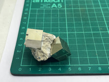Load image into Gallery viewer, Pyrite cubes on matrix
