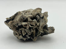 Load image into Gallery viewer, Magnetite on orthoclase
