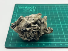 Load image into Gallery viewer, Magnetite on orthoclase
