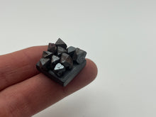 Load image into Gallery viewer, Magnetite on a magnet
