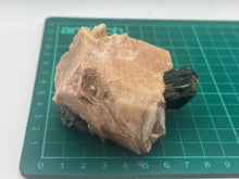Load image into Gallery viewer, Phlogopite mica in orange calcite
