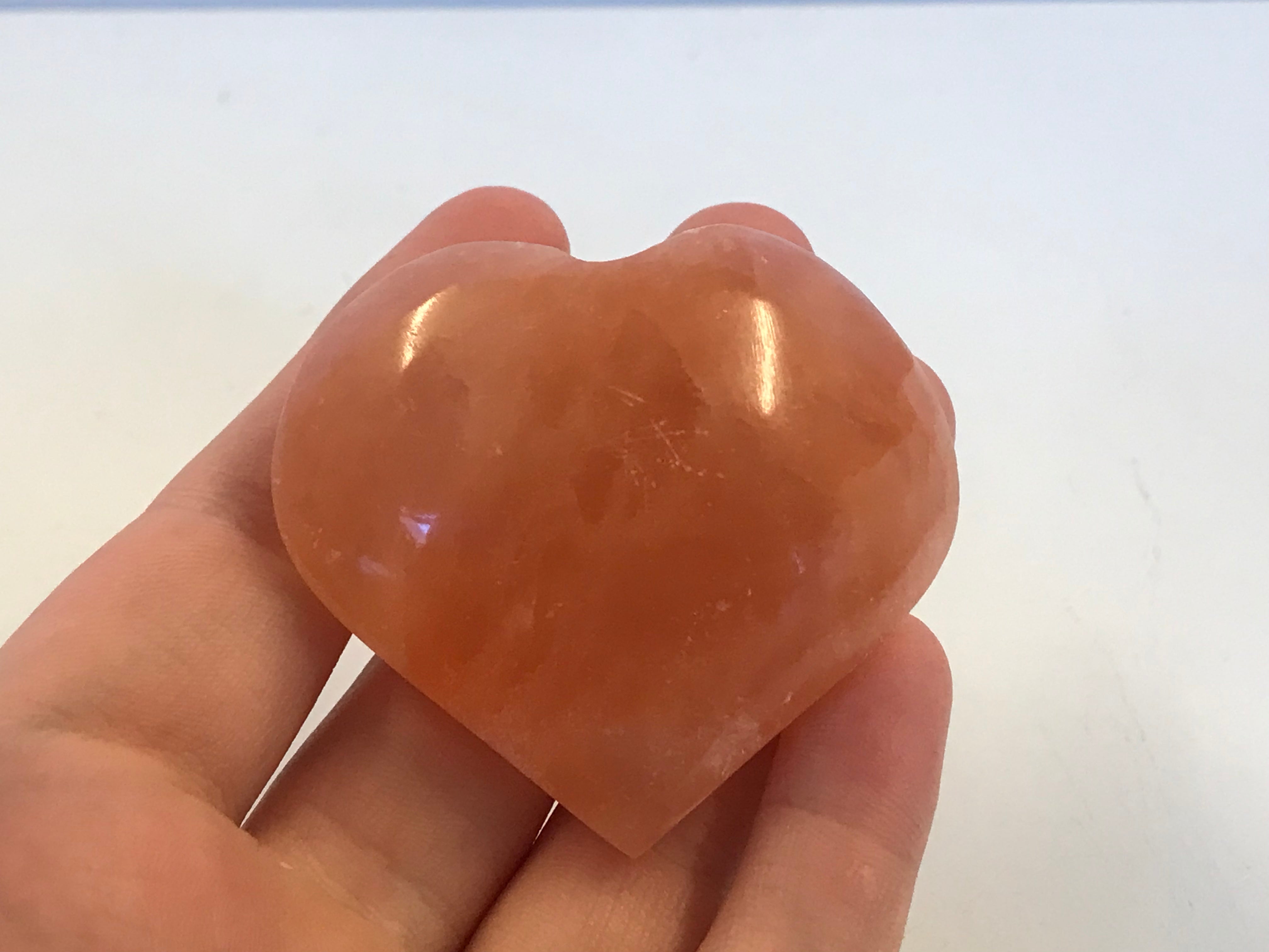 red selenite carved heart – Crystal and fossils